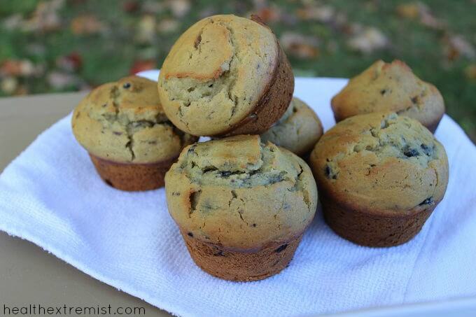 six blueberry muffins stacked on table