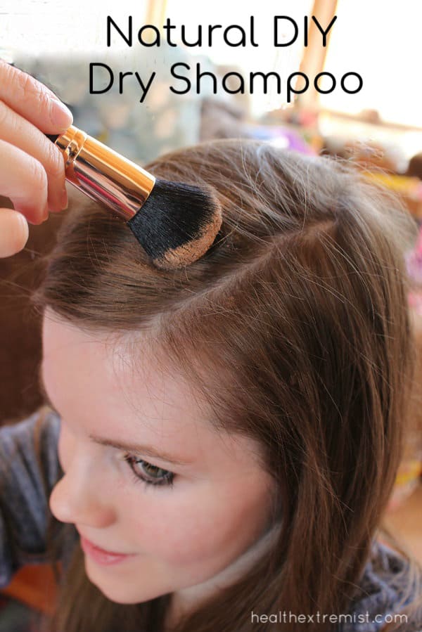 Girl applying dry shampoo using a make-up with text overlay - Natural DIY Dry Shampoo