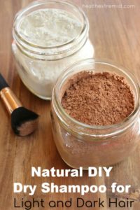 dry shampoo in jars with brush with text overlay - natural diy dry shampoo for light and dark hair