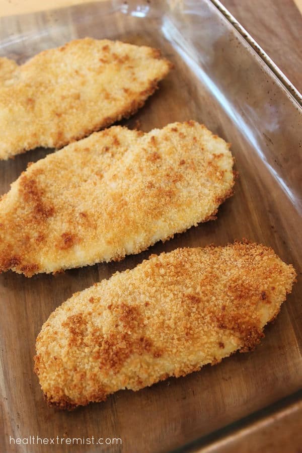 Three slices of chicken in a glass dish