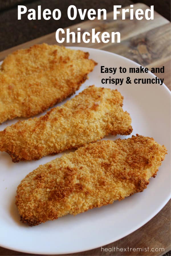 Three slices of chicken on a plate with text overlay - paleo oven fried chicken easy to make and crispy and crunchy