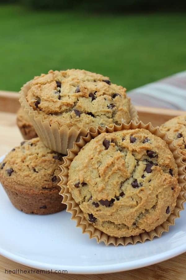 four chocolate chip muffins on a plate