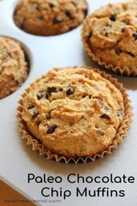 Chocolate chip muffins in muffin pan with text overlay - paleo chocolate chip muffins